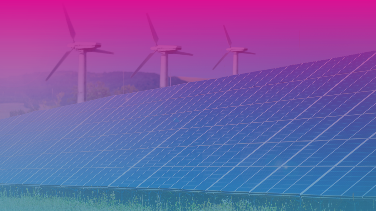 A large solar panel array installed on green grass under a bright blue sky, symbolising renewable energy for business growth.